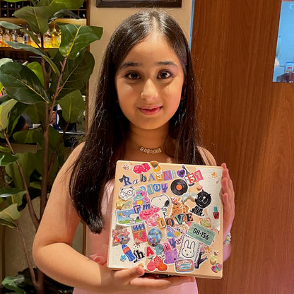 Young girl showcasing her handcrafted box.
