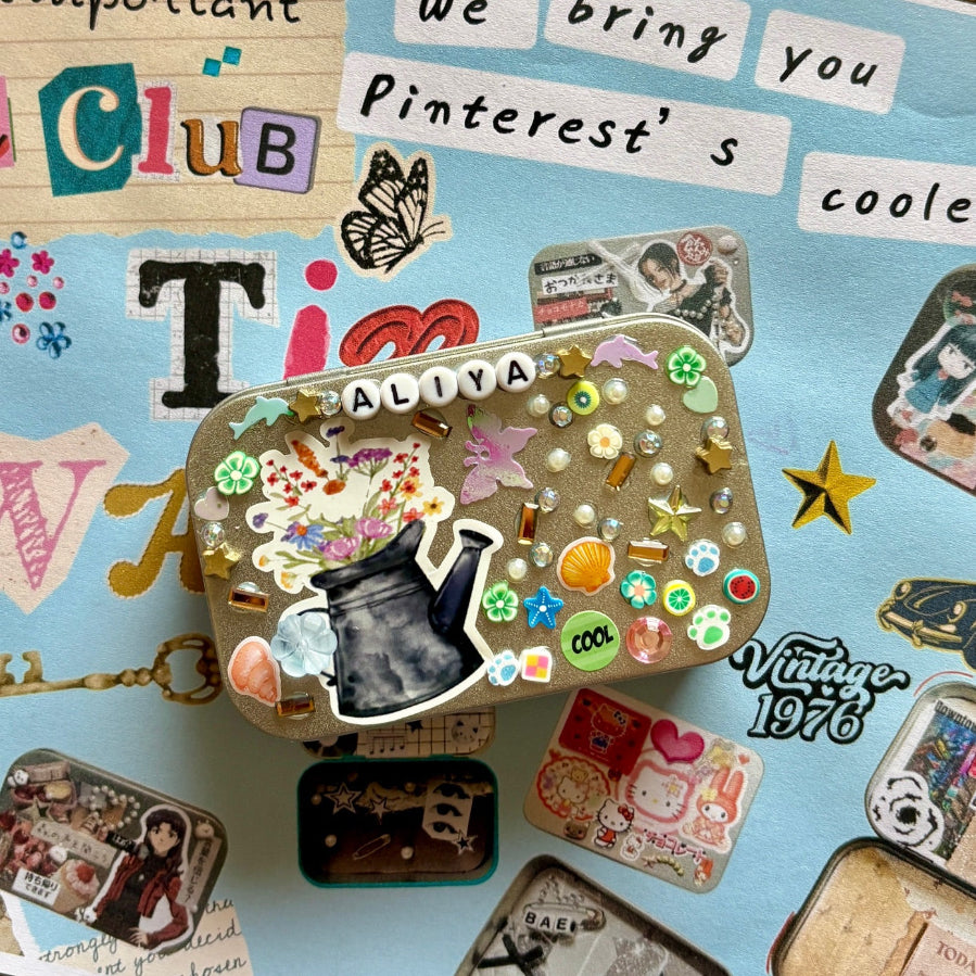 Decorative tin with stickers and text on a collage background