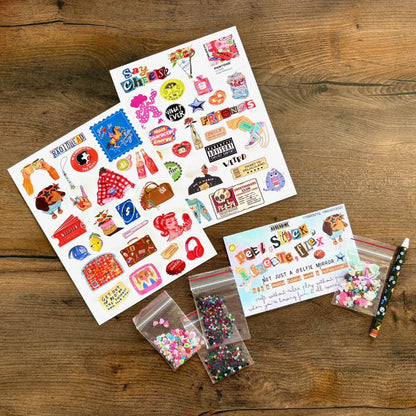 Colorful stickers and accessories on a wooden surface